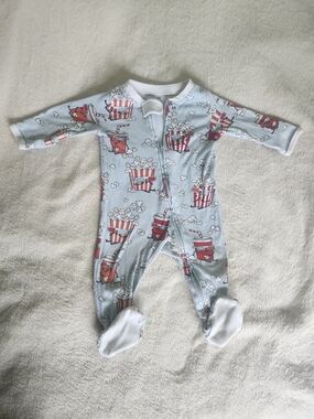 The Honest Company Light Blue Popcorn & Soda Print Footed One-Piece